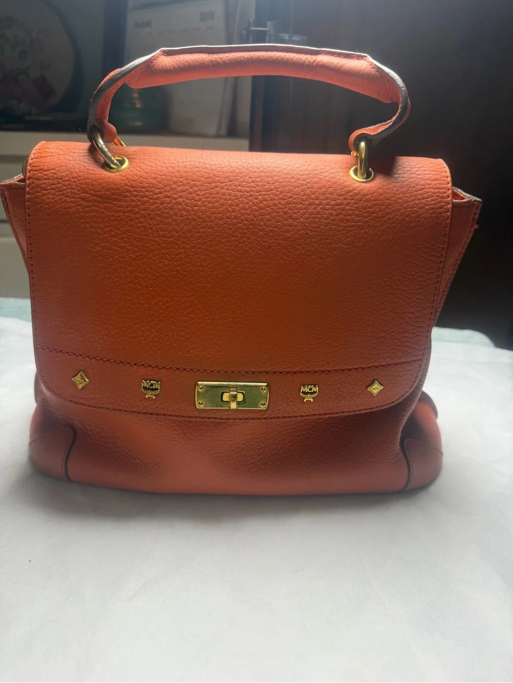Structured Orange Leather Satchel with Top Handle and Crossbody Strap